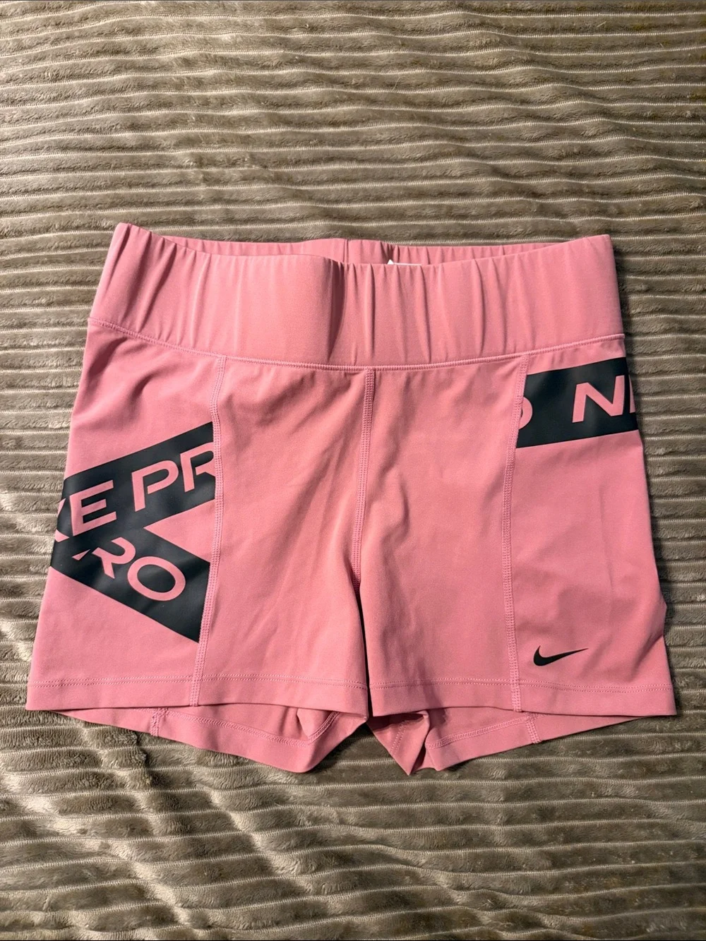 Nike Women’s Pink Athletic Running Shorts with Black Accents